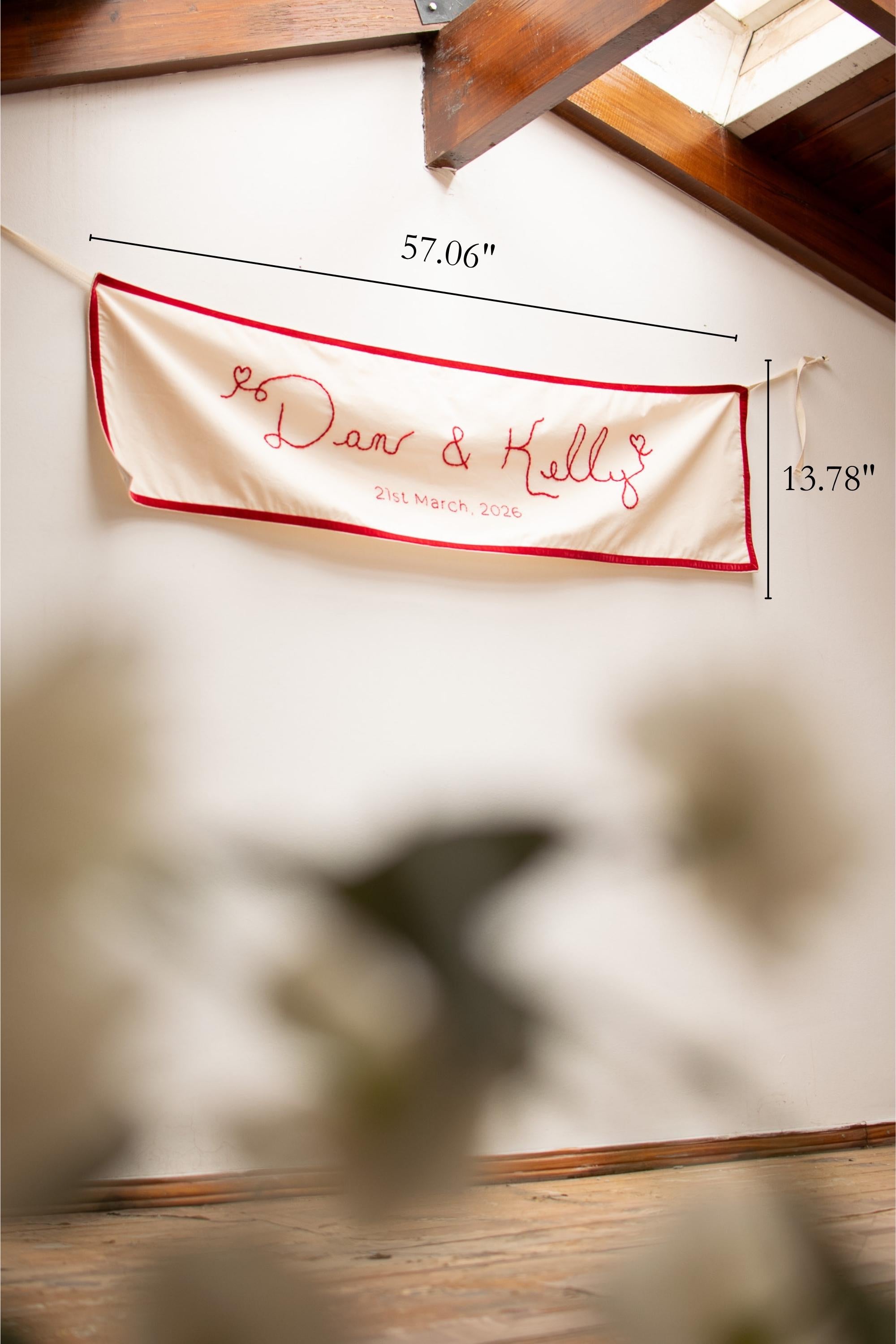 Decorative banner with text and measurements on a wall.