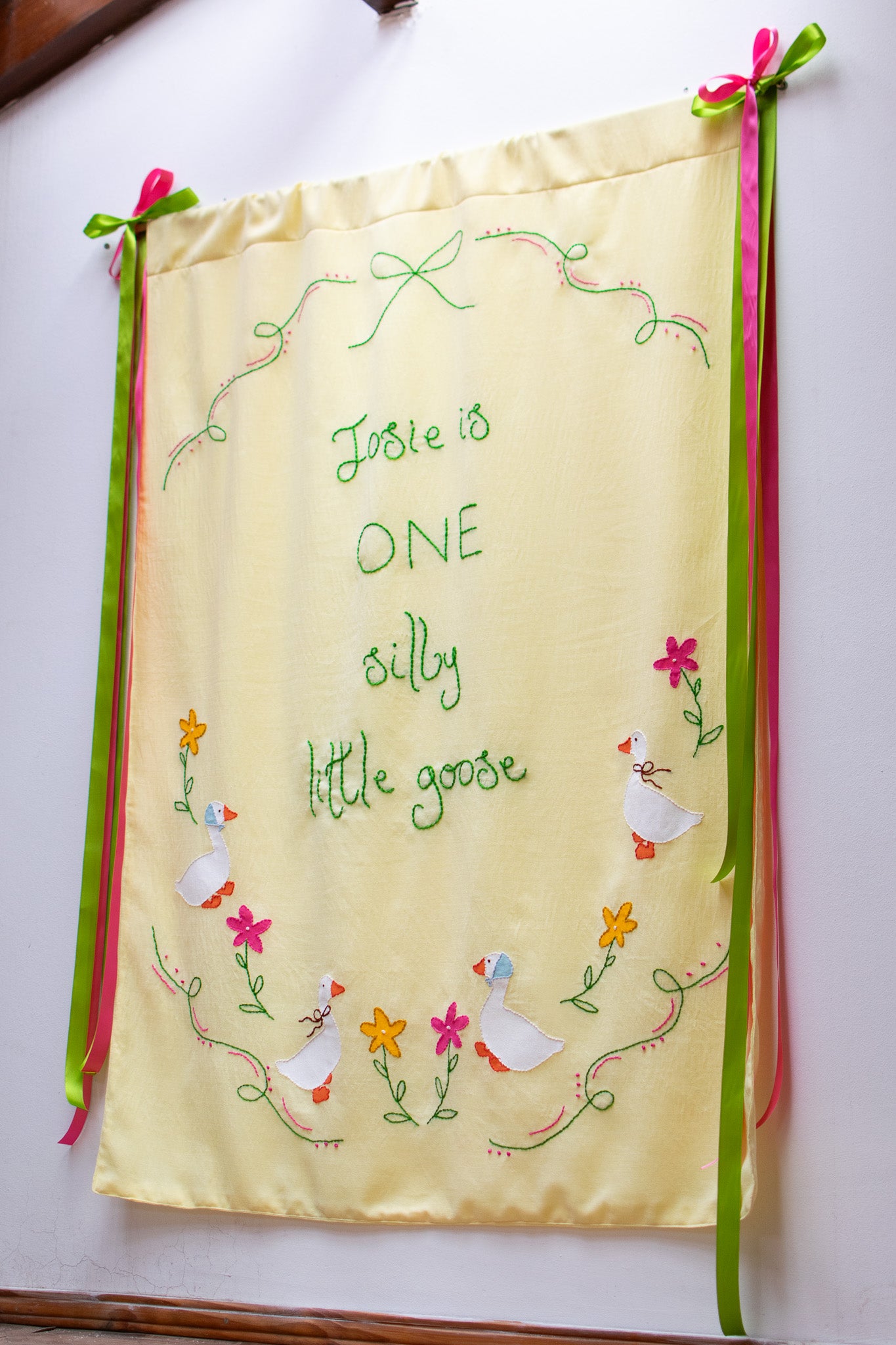 Hand Embroidered First Birthday Banner | Custom Name Goose & Floral Backdrop